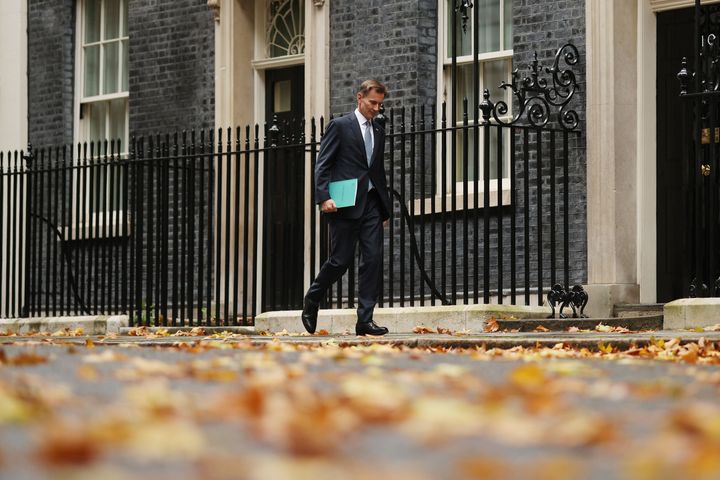 Jeremy Hunt leaves Downing Street to present the autumn statement to the House of Commons.