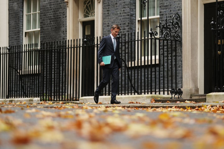 Jeremy Hunt leaves Downing Street to present the autumn statement to the House of Commons.