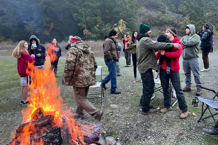 Members of the Yurok, Karuk and Hoopa Valley tribes and other supporters lit a bonfire and watched the vote. (Frankie Myers/Yurok Tribe via AP)