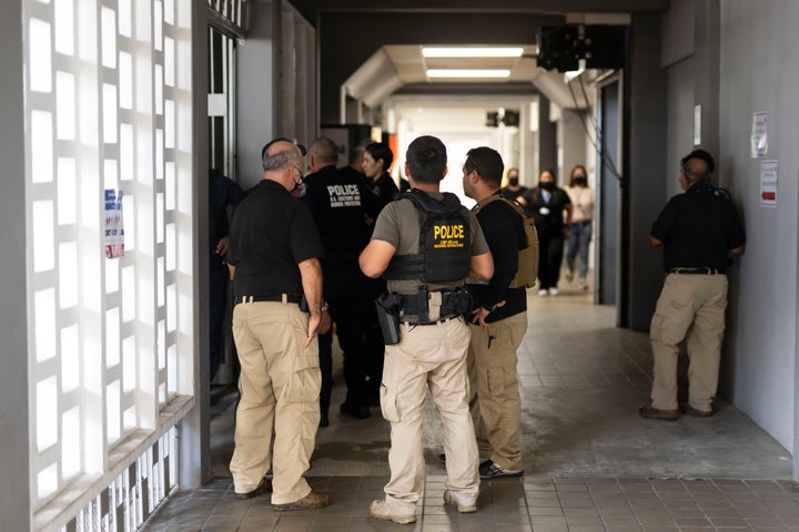 Federal agents wait for news of their injured colleagues outside the Rio Piedras Medical Center in San Juan, Puerto Rico, Thursday, Nov. 17, 2022, who were airlifted from the coast of Cabo Rojo, a major drug smuggling corridor for cocaine coming out of South America known as the Mona Passage. A U.S. Customs and Border Protection agent and a suspected smuggler died during a shootout Thursday off the Puerto Rican coast, authorities said. (Courtesy of Carlos Giusti/GFR MEDIA via AP)