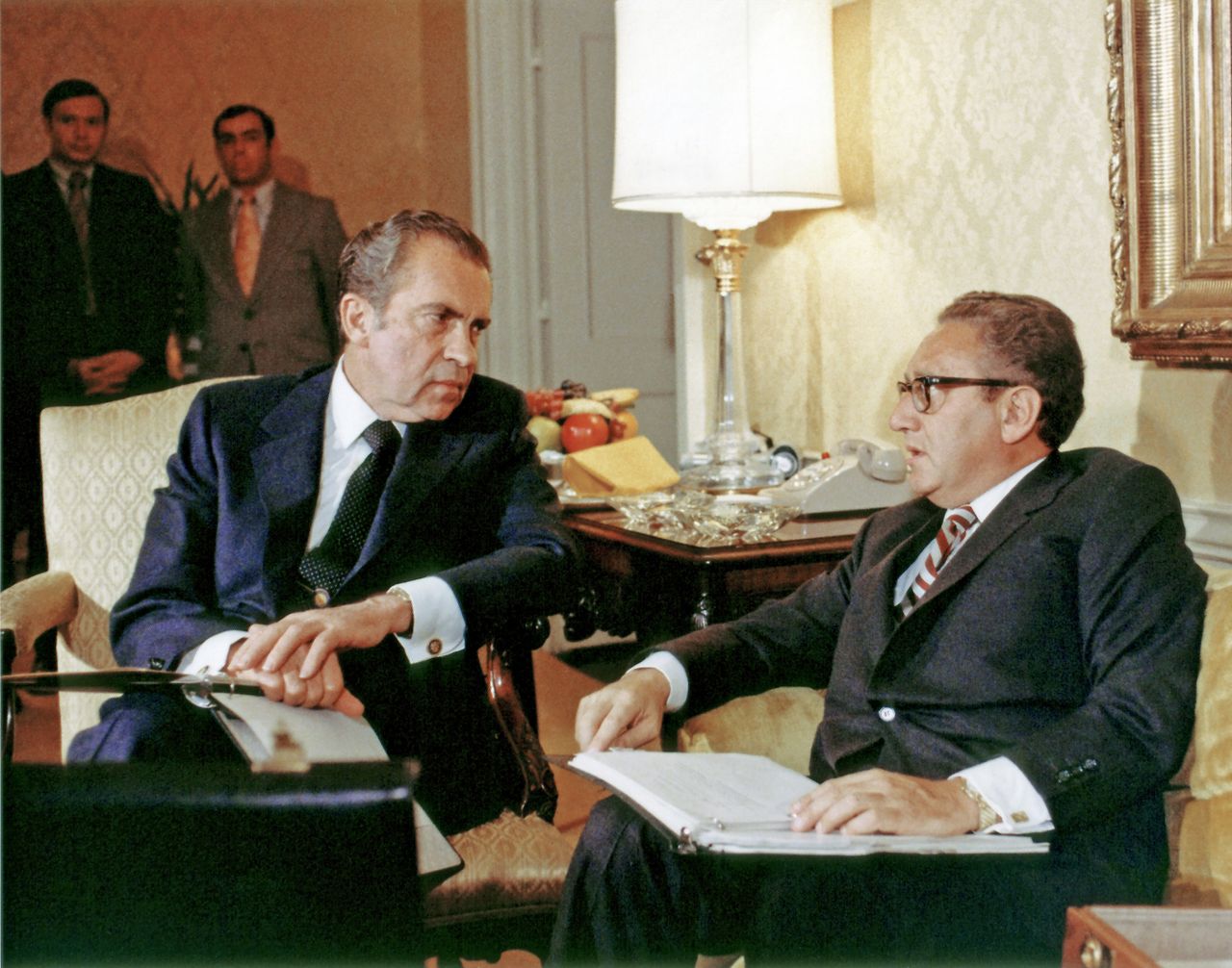 President Richard Nixon (left) and Kissinger, as national security adviser, talk together in Washington on Nov. 25, 1972.