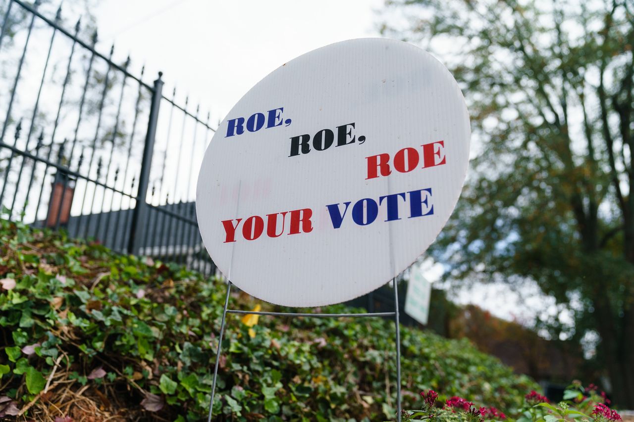 A lawn sign encouraging voting references the Roe v. Wade decision is seen in Atlanta on Nov. 7.