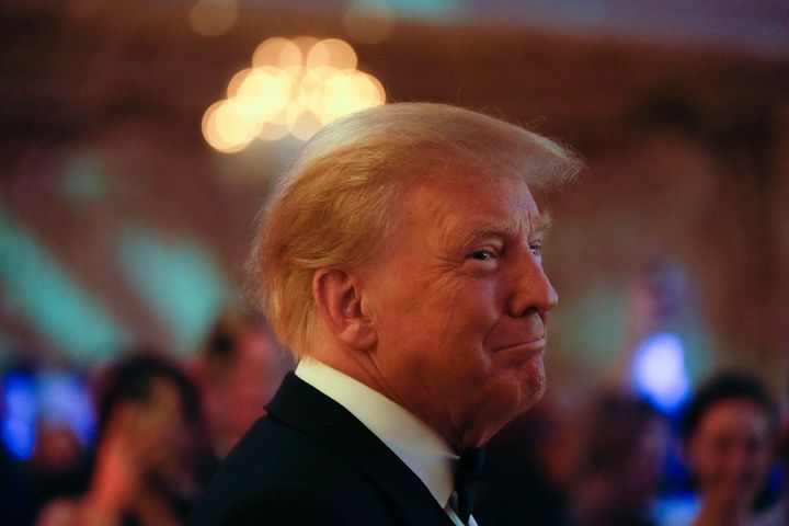 Former President Donald Trump smiles toward guests, as he arrives to speak at an event at Mar-a-Lago, Friday, Nov. 18, 2022, in Palm Beach, Fla. Earlier in the day Attorney General Merrick Garland named a special counsel to oversee the Justice Department's investigation into the presence of classified documents at Trump's Florida estate and aspects of a separate probe involving the Jan. 6, 2021, insurrection and efforts to undo the 2020 election. (AP Photo/Rebecca Blackwell)