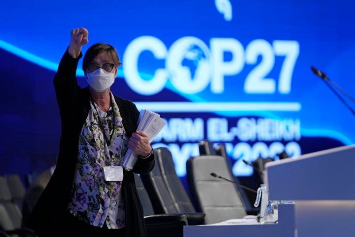 A woman gestures as a closing plenary session begins at the COP27 U.N. Climate Summit, Sunday, Nov. 20, 2022, in Sharm el-Sheikh, Egypt. (AP Photo/Peter Dejong)