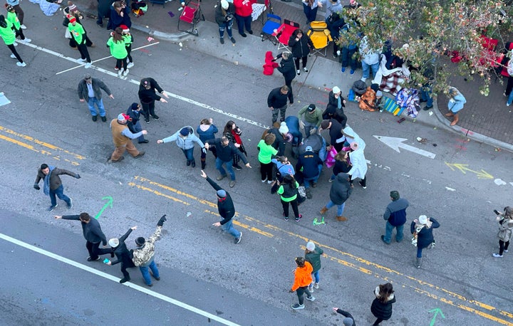 Personnel rush to where a person was injured during the Raleigh Christmas Parade in Raleigh on Saturday.