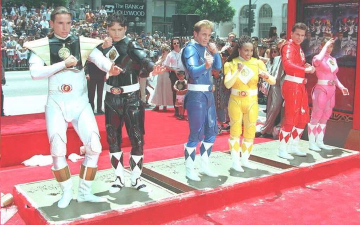 The cast of the "Mighty Morphin Power Rangers," including Frank as the White Ranger (left), strike poses in cement at Mann's Chinese Theater in Hollywood following the release of their first movie, "Mighty Morphin Power Rangers: The Movie," in 1995.