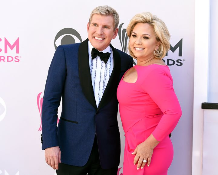 Todd Chrisley, left, and his wife, Julie Chrisley, pose for photos at the 52nd annual Academy of Country Music Awards on April 2, 2017.