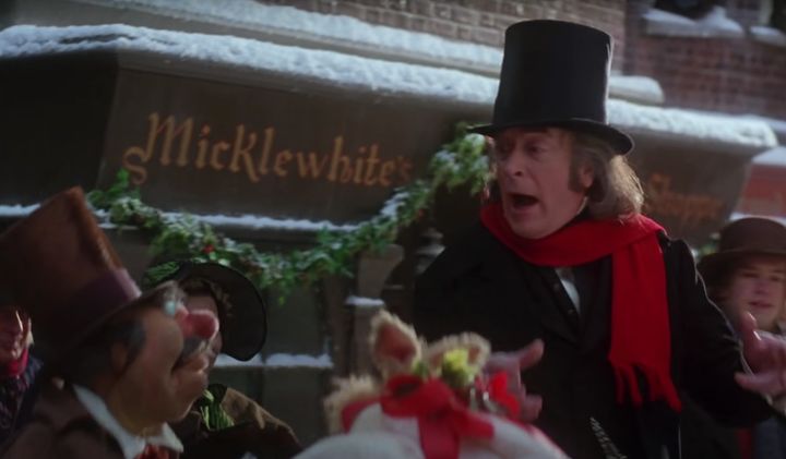 Michael Caine singing outside a shop bearing his real name in The Muppet Christmas Carol
