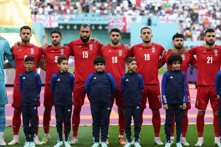 Iran players stand in silence during the national anthem ahead of their Qatar 2022 World Cup match Monday.