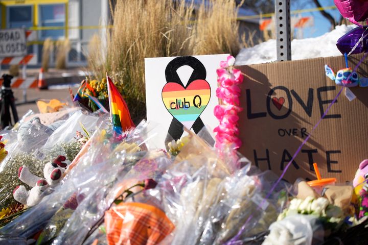 Bouquets of flowers sit on a corner near the site of the mass shooting at Club Q, a gay nightclub in in Colorado Springs, Colorado, over the weekend.