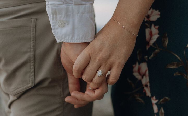 The author with her fiancé, wearing the ring they chose together.