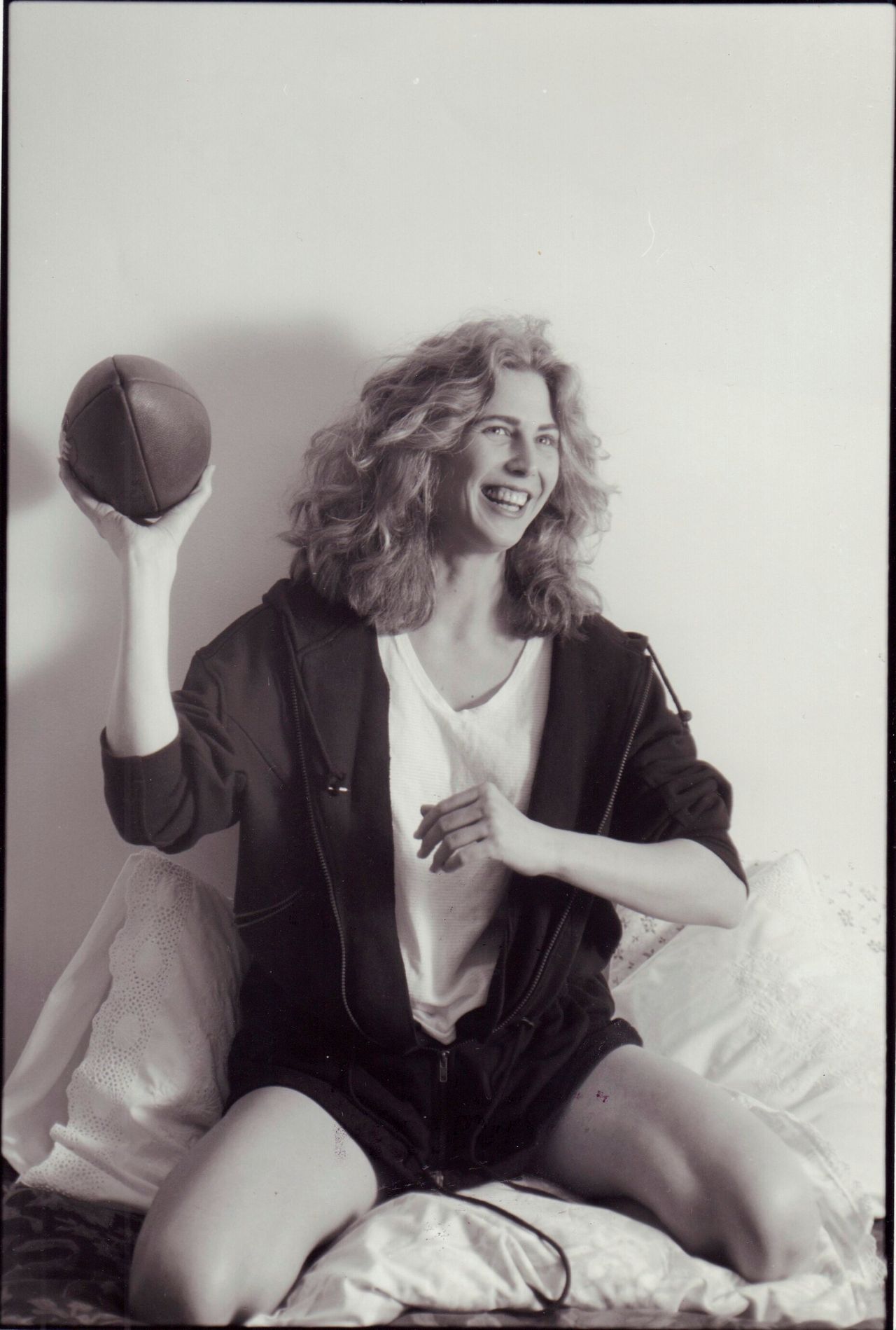 Hawkins tosses a football in her apartment in Manhattan on March 26, 1992.