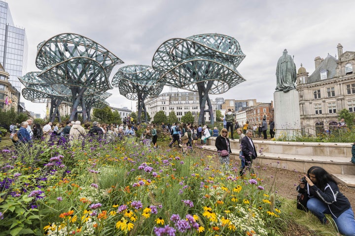 Crowds gather at the opening of PoliNations, a garden in Birmingham's Victoria Square.