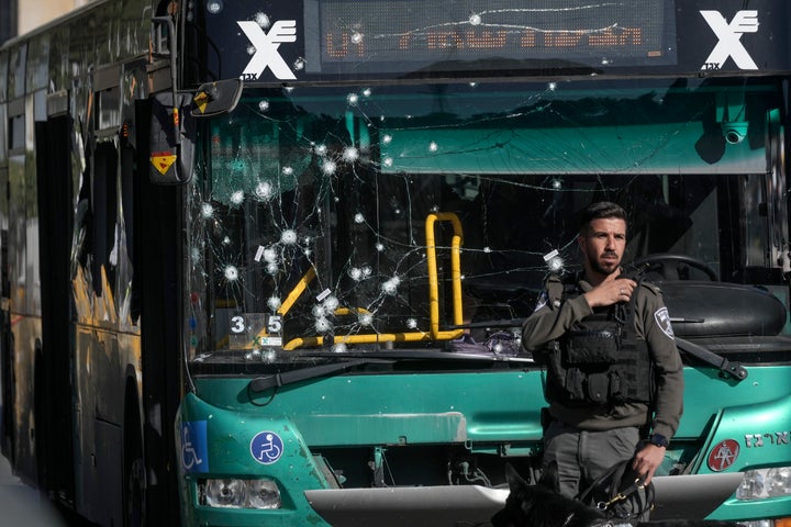 Israeli police inspect the scene of an explosion at a bus stop in Jerusalem, on Nov. 23, 2022.