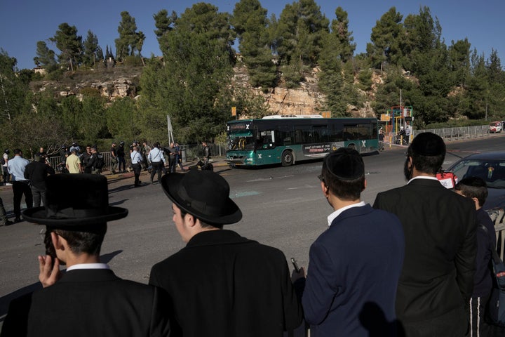 People look at the scene of an explosion at a bus stop in Jerusalem, on Nov. 23, 2022.