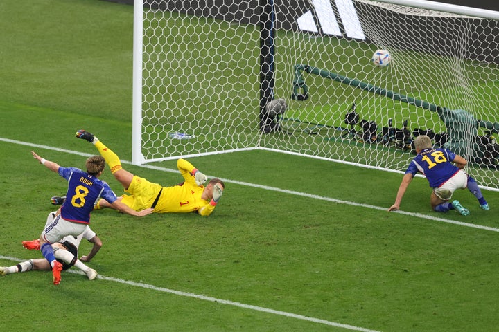 DOHA, QATAR - NOVEMBER 23: Ritsu Doan of Japan scores thier 1st goal during the FIFA World Cup Qatar 2022 Group E match between Germany and Japan at Khalifa International Stadium on November 23, 2022 in Doha, Qatar. (Photo by Marc Atkins/Getty Images)