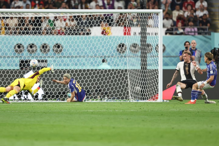 DOHA, QATAR - NOVEMBER 23: Ritsu Doan of Japan scores a goal to make it 1-1 during the FIFA World Cup Qatar 2022 Group E match between Germany and Japan at Khalifa International Stadium on November 23, 2022 in Doha, Qatar. (Photo by Matthew Ashton - AMA/Getty Images)