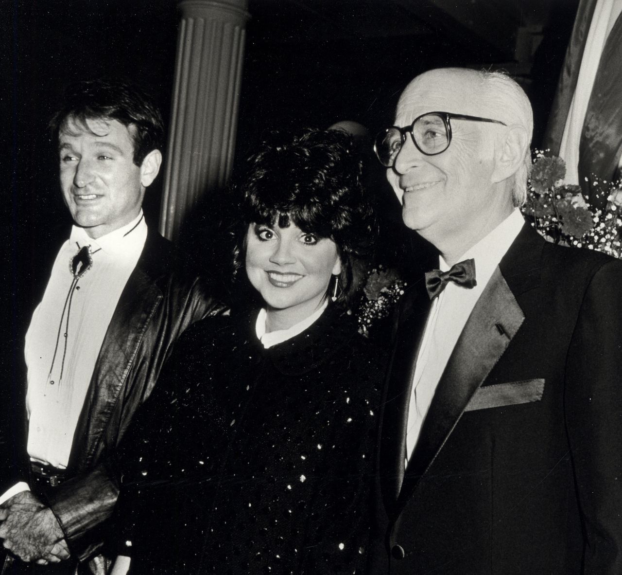 Lear (right) with singer Linda Ronstadt and actor Robin Williams at the Dinner Dance for People of the American Way on Oct. 24, 1985, at the Puck Building in New York City.
