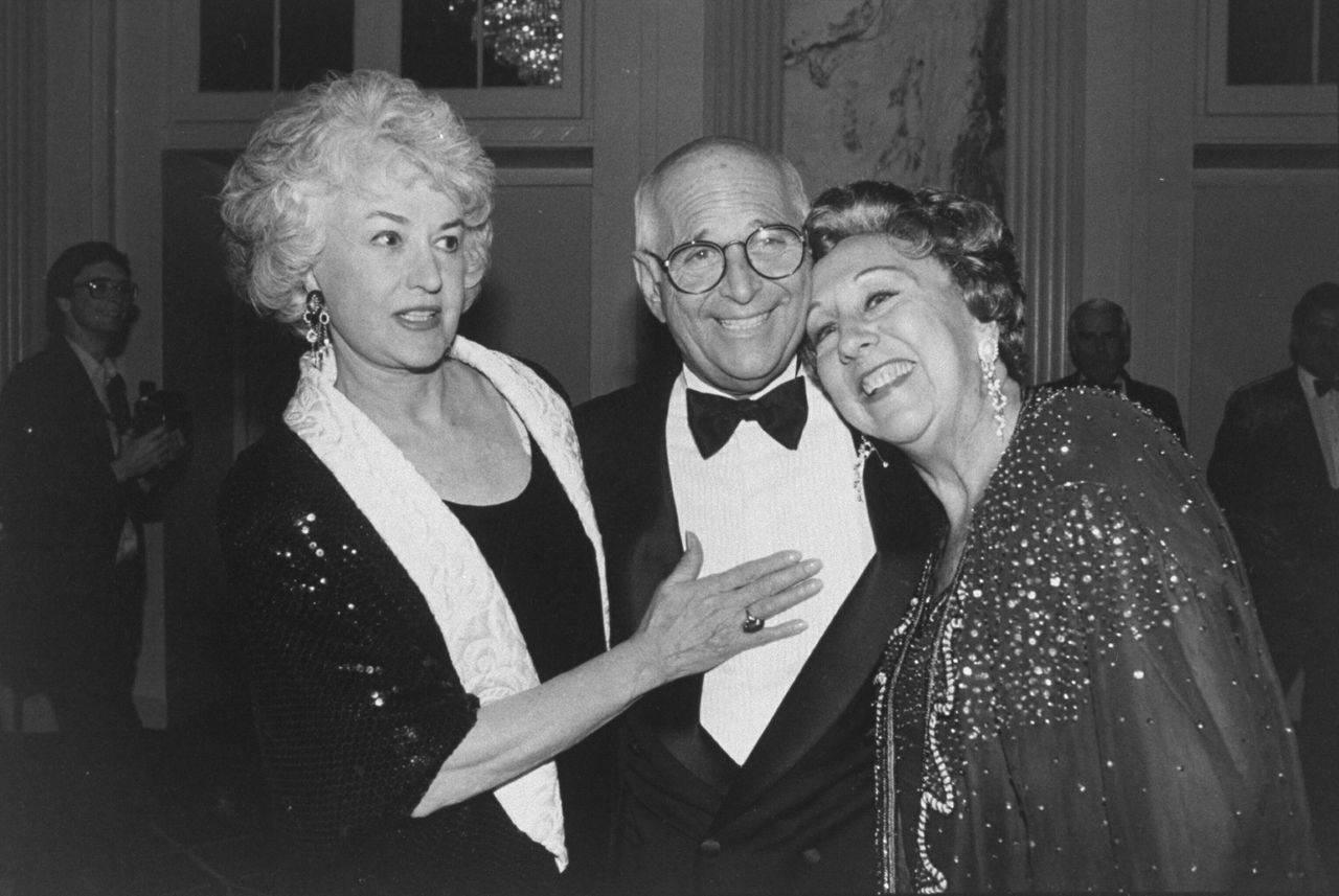 Lear snuggling between Bea Arthur (left) and Jean Stapleton (right) at the 10th anniversary of People for the American Way on Nov. 2, 1990.