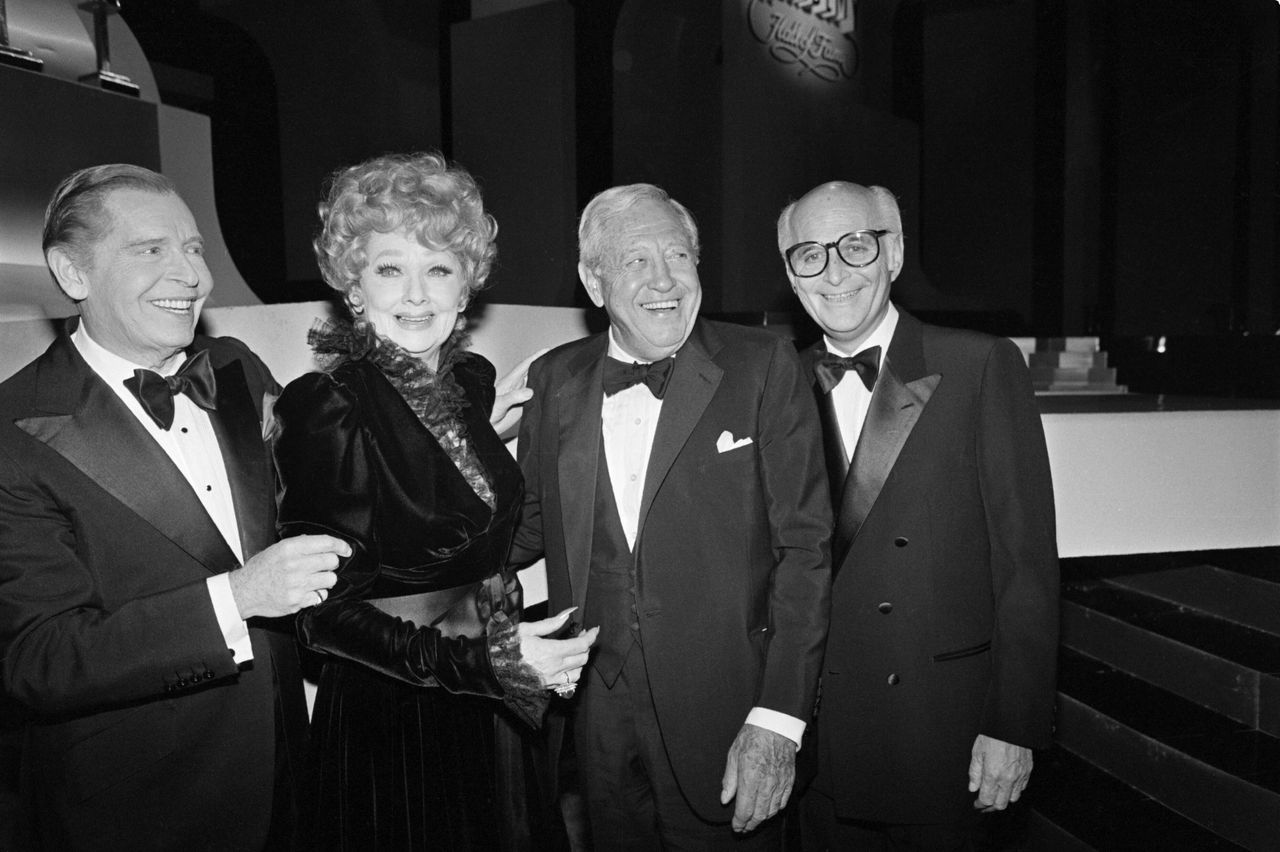 Milton Berle, Lucille Ball, former CBS Chairman William S. Paley and Lear smile for photographers as they are inducted into the Academy of Television Arts and Sciences Hall of Fame in Hollywood, California, on Jan. 21, 1984.