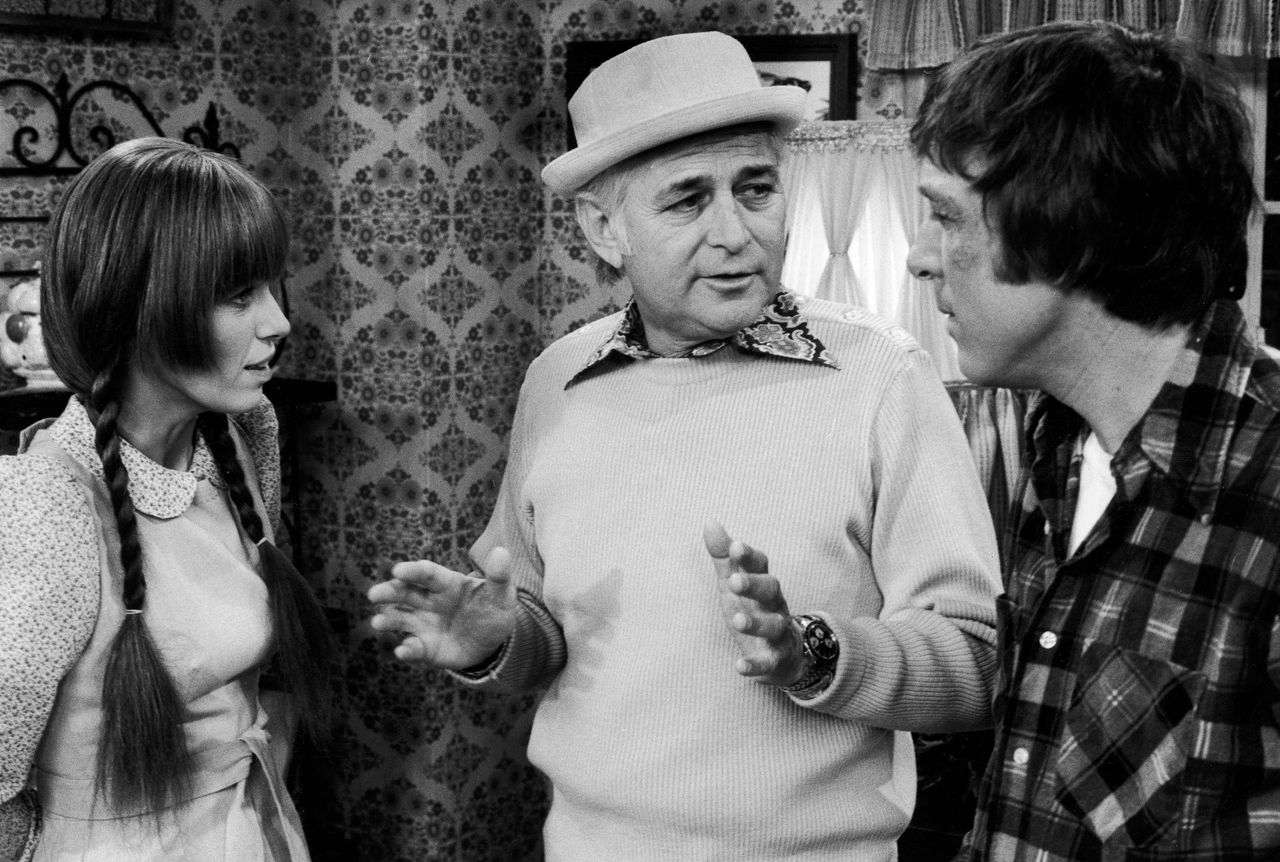 Lear (center) speaking with series star Louise Lasser (left) and co-star Greg Mullavey (right) on the set of TV show "Mary Hartman, Mary Hartman" in between takes in April 1976.