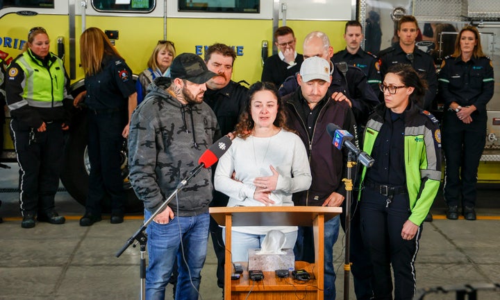 Paramedic Jayme Erickson, center, who was called to a crash last week and didn't know she was trying to save her own daughter because the injuries were too severe.