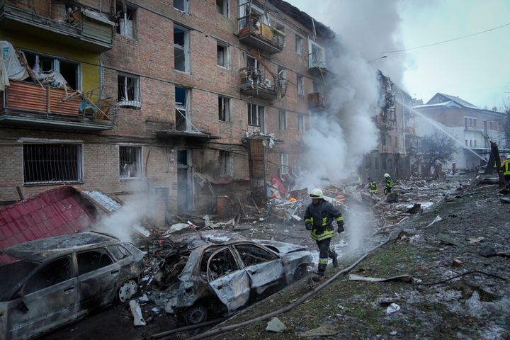Ukrainian State Emergency Service firefighters work to extinguish a fire at the scene of a Russian shelling in the town of Vyshgorod outside the capital Kyiv, Ukraine, on Nov. 23, 2022. 