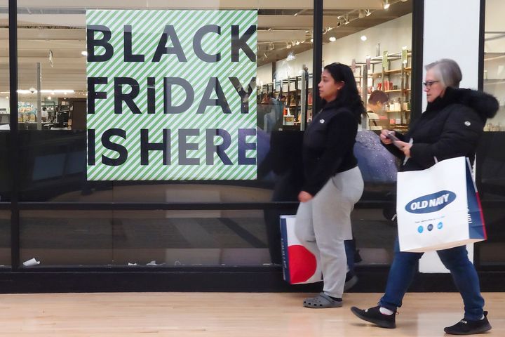 A "Black Friday" sign is posted at a retail location in Philadelphia, Monday, Nov. 21, 2022. Bargain hunting is back with full force heading into the holidays. But inflation is limiting how much of a deal consumers will be getting. 