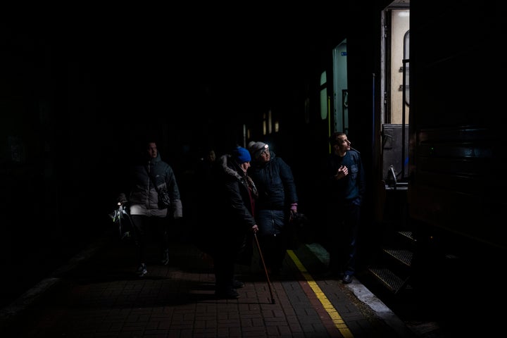 Ukrainians board the Kherson-Kyiv train at the Kherson railway station, southern Ukraine, Saturday, Nov. 26, 2022. Fleeing shelling, hundreds of civilians on Saturday streamed out of the southern Ukrainian city whose recapture they had celebrated just weeks earlier. (AP Photo/Bernat Armangue)