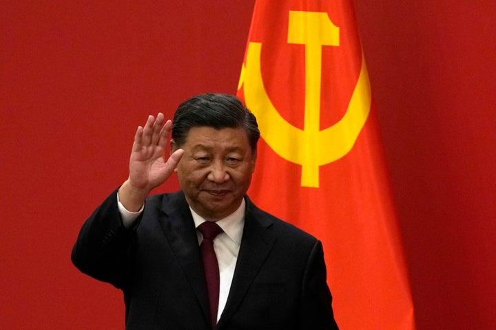 Chinese President Xi Jinping waves at an event to introduce new members of the Politburo Standing Committee at the Great Hall of the People in Beijing on Oct. 23, 2022. Barely a month after granting himself new powers as China’s possible leader for life, Xi is facing a wave of public anger of the kind not seen for decades, sparked by his draconian “zero-COVID” program that will soon enter its fourth year.