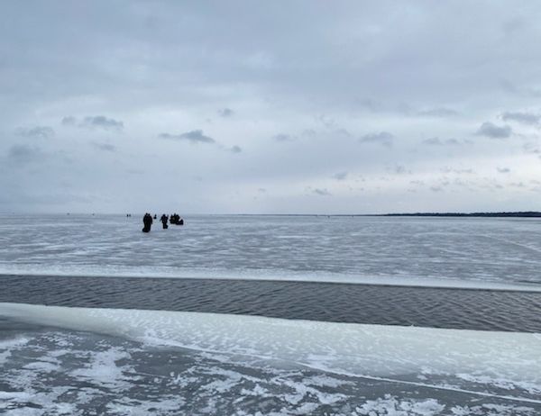Stranded anglers on a piece of ice make their way to rescuers on Upper Red Lake in Minnesota on Monday, Nov. 28.