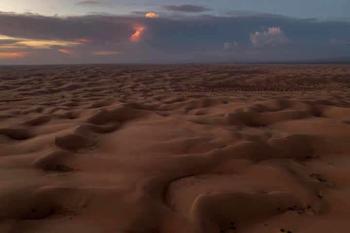 In an aerial view, the Imperial Sand Dunes of California's Colorado Desert are seen near to where the All-American Canal conveys water through them on September 28, 2022 near Felicity, California. The 80-mile long canal carries water from the Colorado River to supply nine Southern California cities and 500,000 acres of farmland in the Imperial Valley where a few hundred farms draw more water from the Colorado River than the states of Arizona and Nevada combined. As drought shrinks the Colorado River to historic low levels and with states that rely on it facing major water shortages, pressure is building on the growers to give up some of the water rights they had inherited long ago. The Imperial Sand Dunes are the remnants of the beach sands of ancient Lake Cahuilla, the basin of which is where the dying Salton Sea is located.