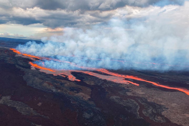 In this aerial photo released by the U.S. Geological Survey, the Mauna Loa volcano is seen erupting from vents on the Northeast Rift Zone on the Big Island of Hawaii, Monday, Nov. 28, 2022. Hawaii's Mauna Loa, the world's largest active volcano, began spewing ash and debris from its summit, prompting civil defense officials to warn residents on Monday to prepare in case the eruption causes lava to flow toward communities.