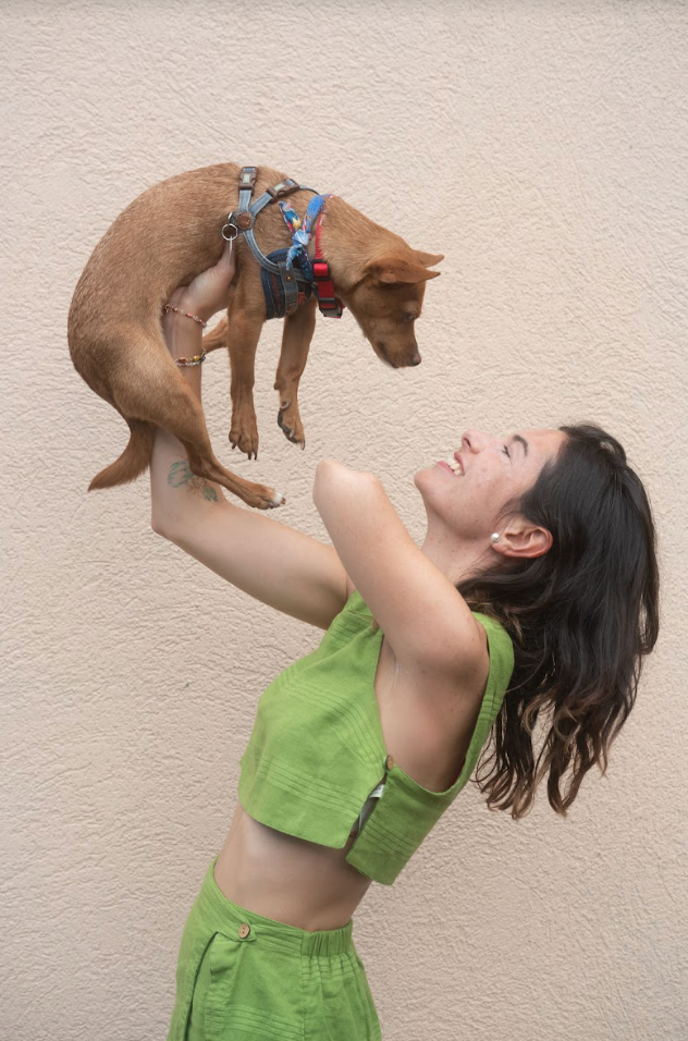 "Precariously (but safely) lifting my trusting Dingo dog up in the air with one hand," the author writes.