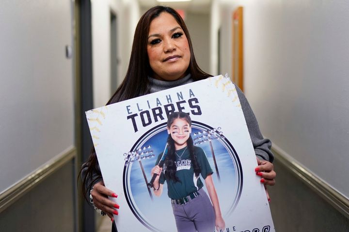 Sandra Torres holds a photo of her daughter Eliahna who was one of 19 students and two teachers killed in the May school shooting in Uvalde, Texas.