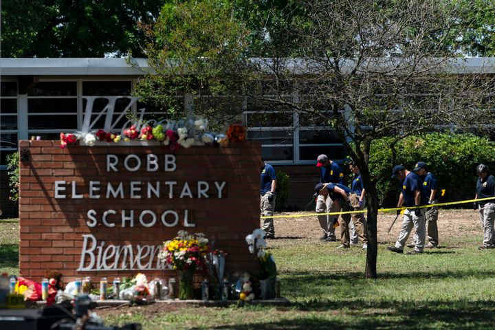 Investigators search for evidence outside Robb Elementary School following the May 25 shooting in Uvalde, Texas.