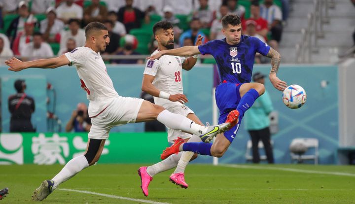 Christian Pulisic scores during the game between Iran and the U.S. in Qatar on Tuesday 29 November 2022. (Photo by VIRGINIE LEFOUR/BELGA MAG/AFP via Getty Images)