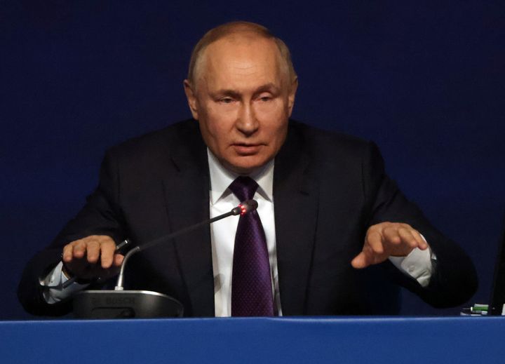  Vladimir Putin gestures during the plenary session of the 10th All-Russia's Congress of Judges at the State Kremlin Palace in Moscow.