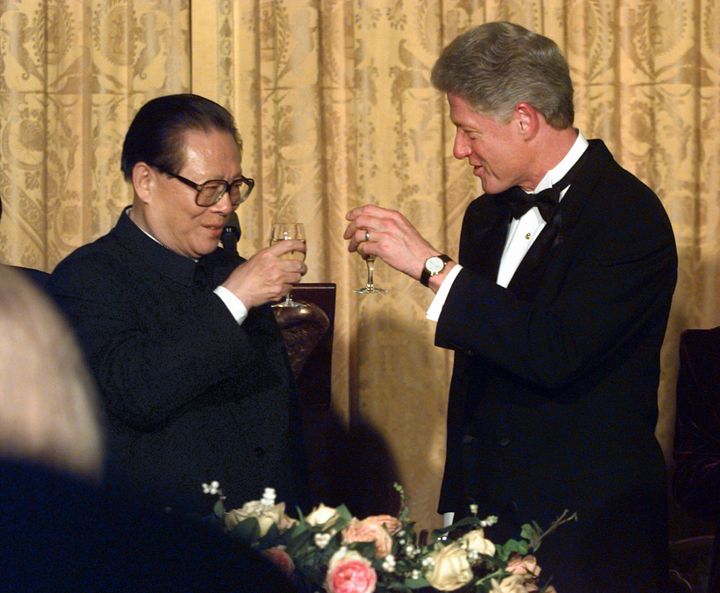 In this Oct. 29, 1997, file photo, U.S. President Bill Clinton, right, and Chinese President Jiang Zemin toast during their state dinner at the White House. 