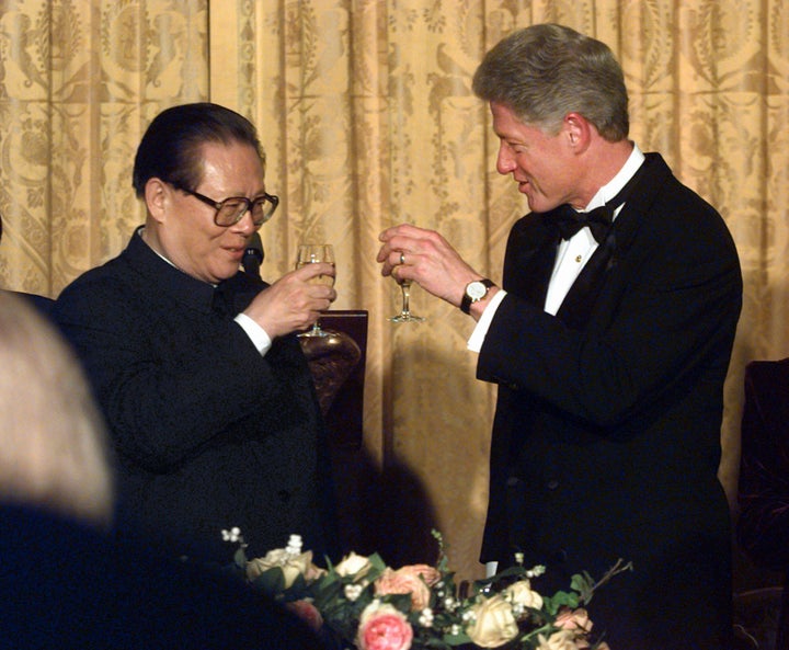 In this Oct. 29, 1997, file photo, U.S. President Bill Clinton, right, and Chinese President Jiang Zemin toast during their state dinner at the White House. 