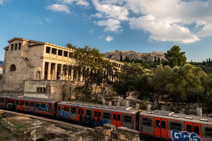 ATHENS, GREECE - 2022/10/12: A train passes by near the Acropolis of Athens. (Photo by Marcos del Mazo/LightRocket via Getty Images)