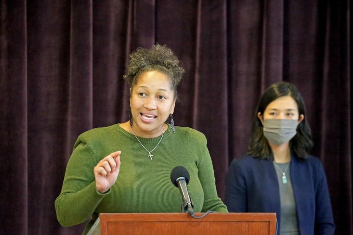 The Reverend Mariama White-Hammond, Chief of Environment, Energy, and Open Space, speaks as Boston Mayor Michelle Wu speaks to the media at VietAID on Dec. 15, 2021.