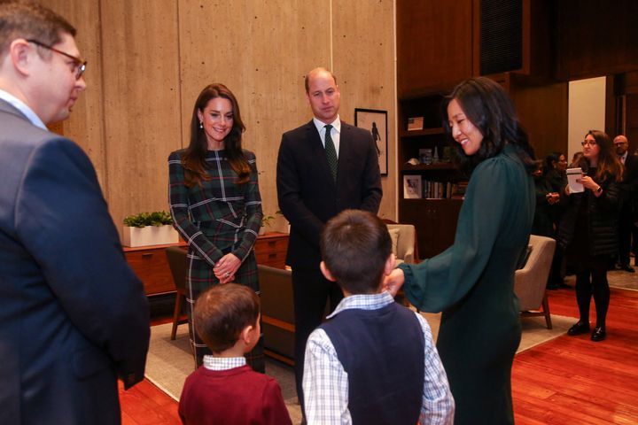 Boston Mayor Michell Wu (right), her sons Blaise and Cass, and husband Conor Perwarski chat with William and Kate on Wednesday in her office at Boston City Hall.