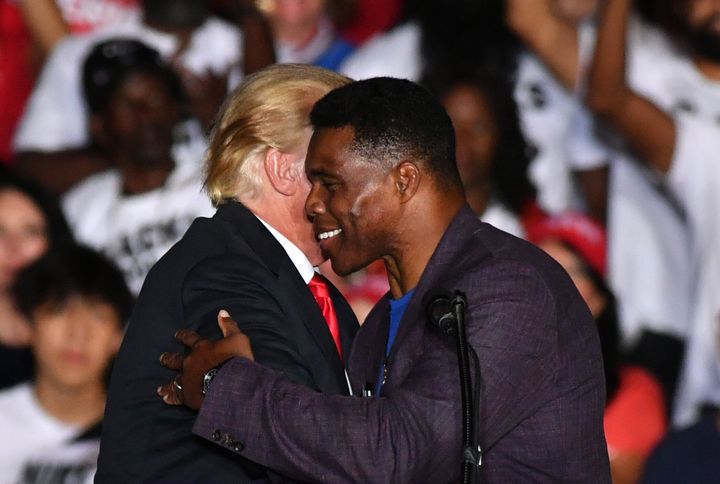 Republican Senate candidate Herschel Walker and former President Donald Trump hold a "Save America" rally in Perry, Georgia, on Sept. 25, 2021.