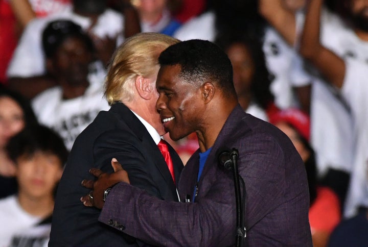 Republican Senate candidate Herschel Walker and former President Donald Trump hold a "Save America" rally in Perry, Georgia, on Sept. 25, 2021.