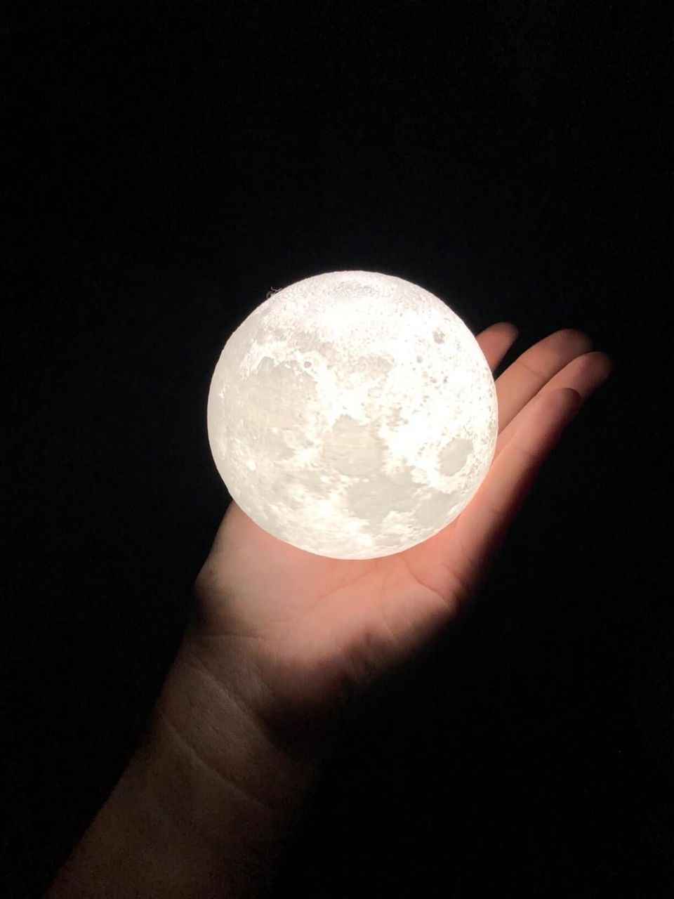An incredibly detailed, dual color moon-shaped light