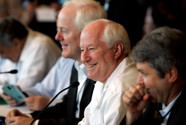 FILE - Rep. Jim Kolbe, R -Ariz., center right, speaks to members of the Mexican delegation during the Mexico-U.S. Interparliamentary Meeting in Valle de Bravo, Mexico, on March 3, 2006. At left is Sen. John Cornyn, R-Texas, and at right is Rep. Michael McCaul, R-Texas. Kolbe, a Republican congressman who represented a heavily Democratic region of Arizona for more than two decades and was a proponent of gay rights, died Saturday, Dec. 3, 2022. He was 80. (AP Photo/Gregory Bull, File)