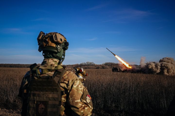 TOPSHOT - A Ukrainian soldier watches a self-propelled 220 mm multiple rocket launcher "Bureviy" firing towards Russian positions on the front line, eastern Ukraine on November 29, 2022, amid the Russian invasion of Ukraine. (Photo by ANATOLII STEPANOV / AFP) (Photo by ANATOLII STEPANOV/AFP via Getty Images)