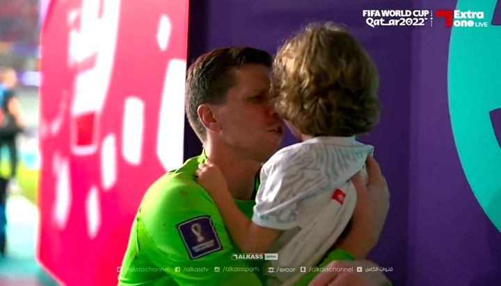 A Polish footballer was seen comforting his son immediately after his team lost