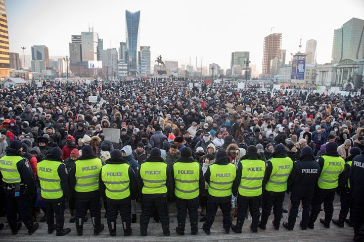 Protesters gather on Sukhbaatar Square in Ulaanbaatar in Mongolia on Monday, Dec. 5, 2022. Protesters angered by allegations of corruption linked to Mongolia's coal trade with China have stormed the State Palace in the capital, demanding dismissals of officials involved in the scandal. (AP Photo/Alexander Nikolskiy)